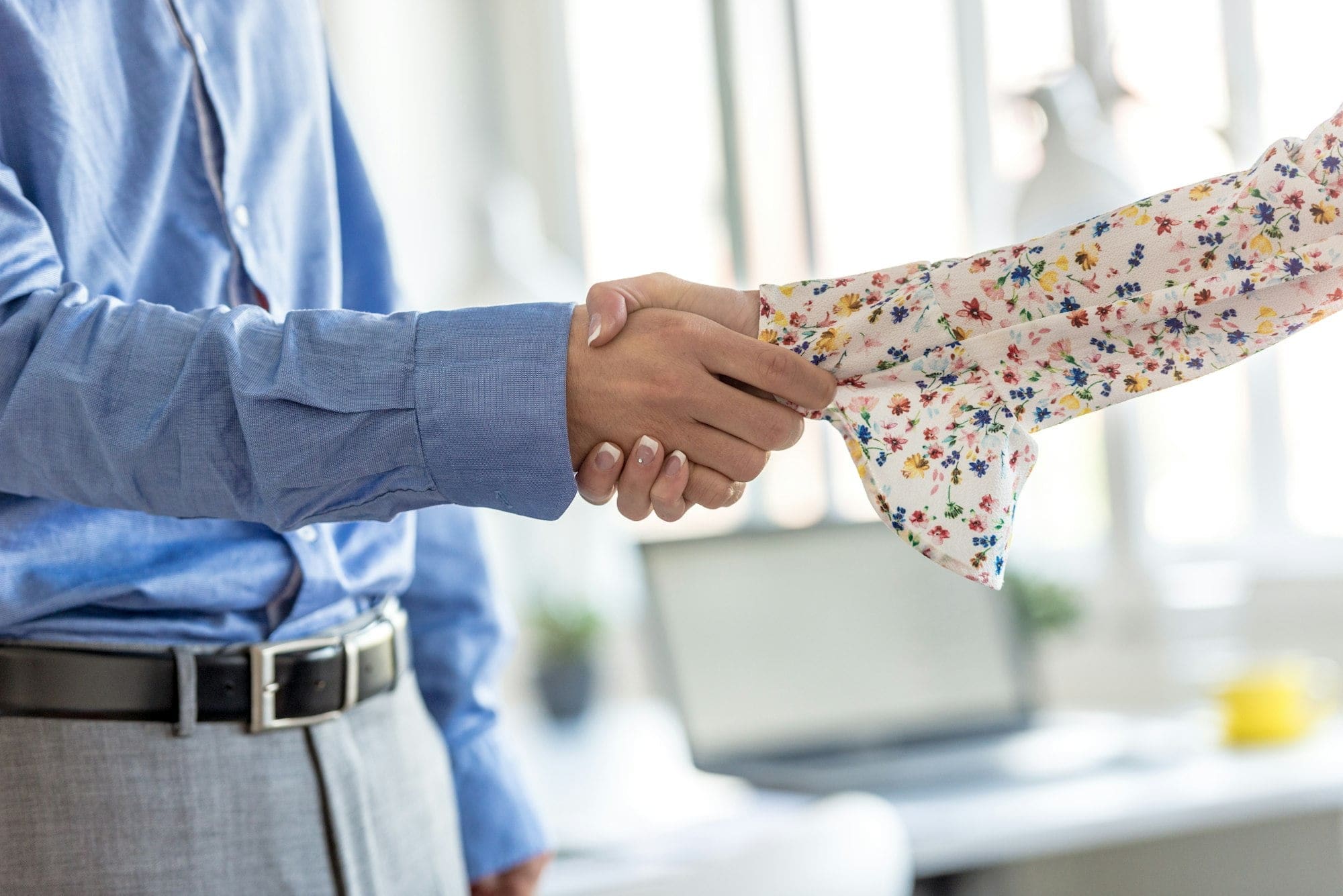 Businessman and woman handshake